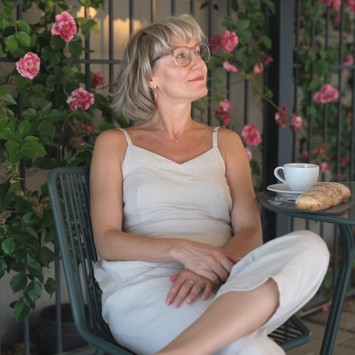 woman enjoying a peaceful evening with tea and a sandwich without alcohol