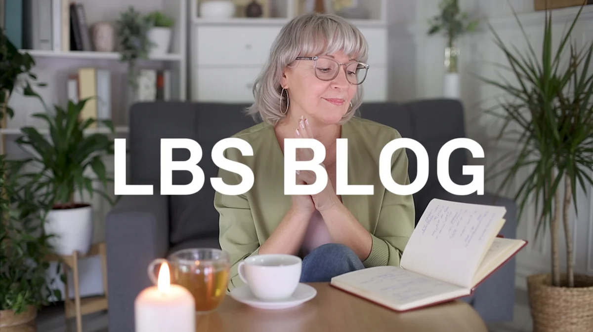 Woman reading and reflecting in a calm evening setting for the Live Better Sober blog