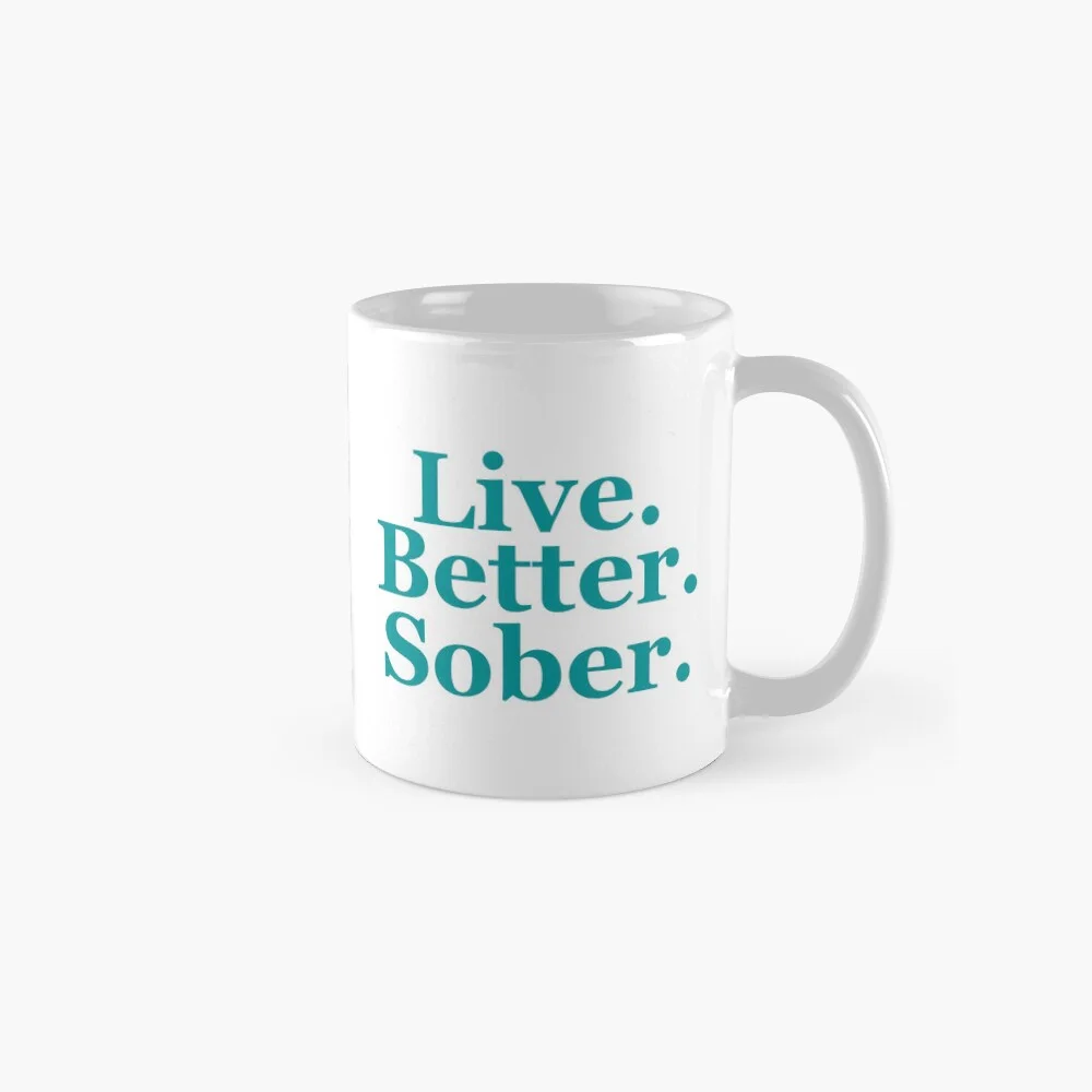 White coffee mug with turquoise “Live. Better. Sober.” typography design.