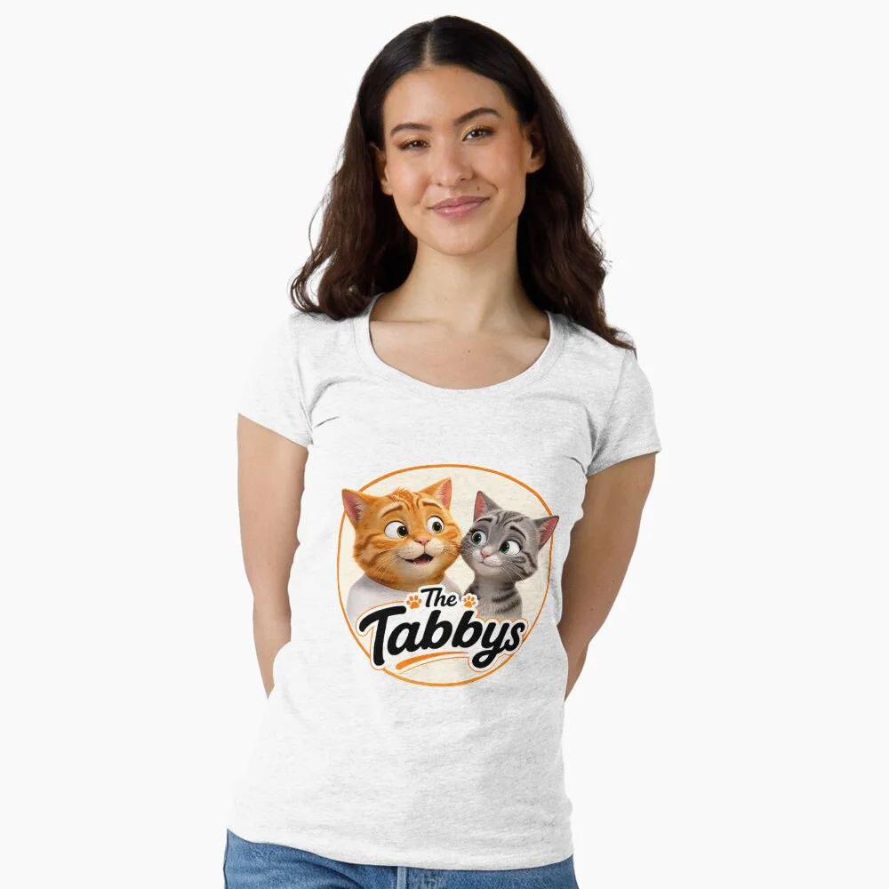 Woman wearing a white fitted scoop neck T-shirt featuring The Tabbys logo with George and Maggie the tabby cats.