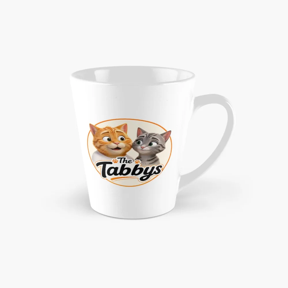 White tall mug featuring The Tabbys logo with George and Maggie the tabby cats.